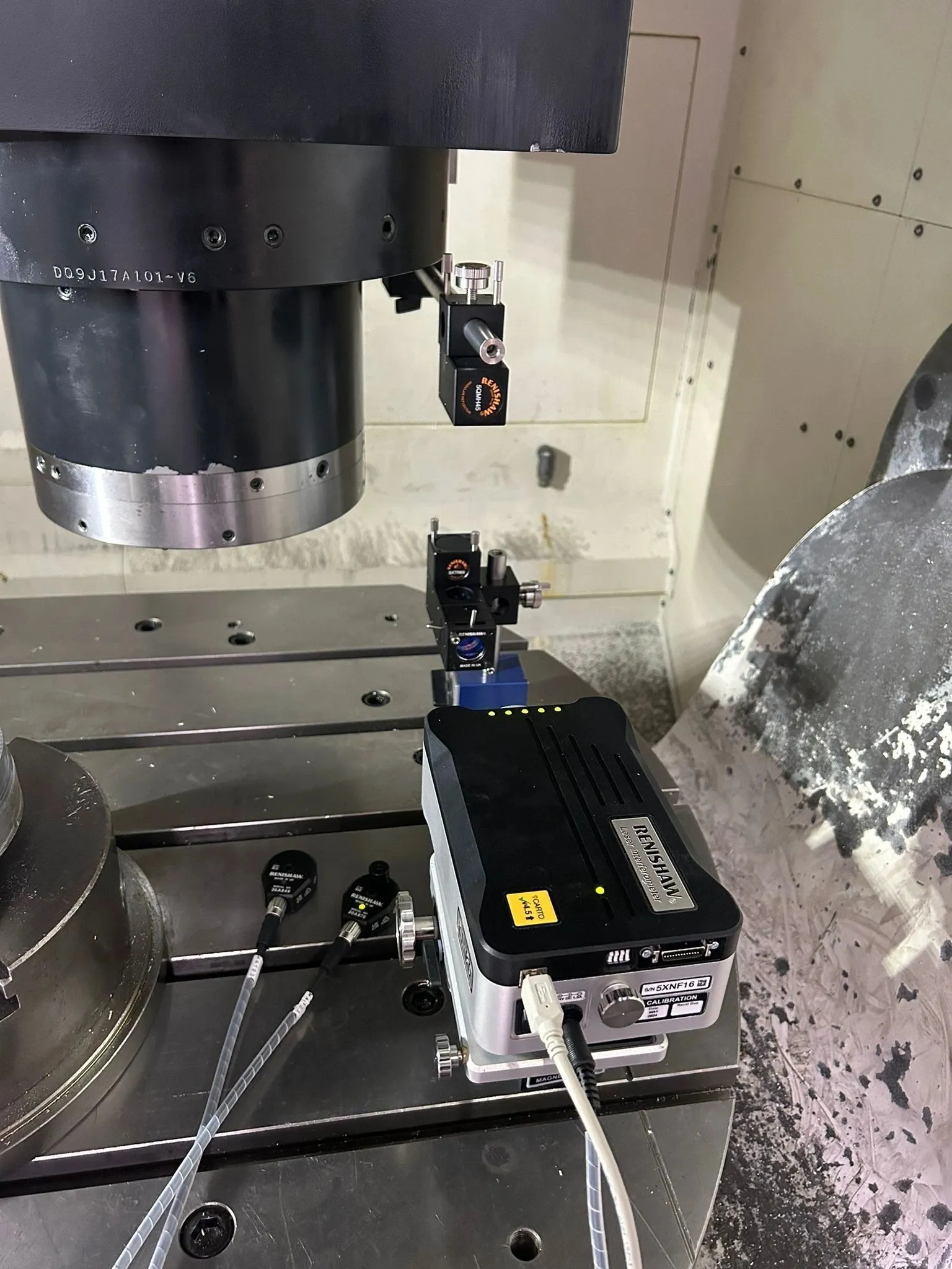 Laser optics under the spindle with the laser unit, close-up